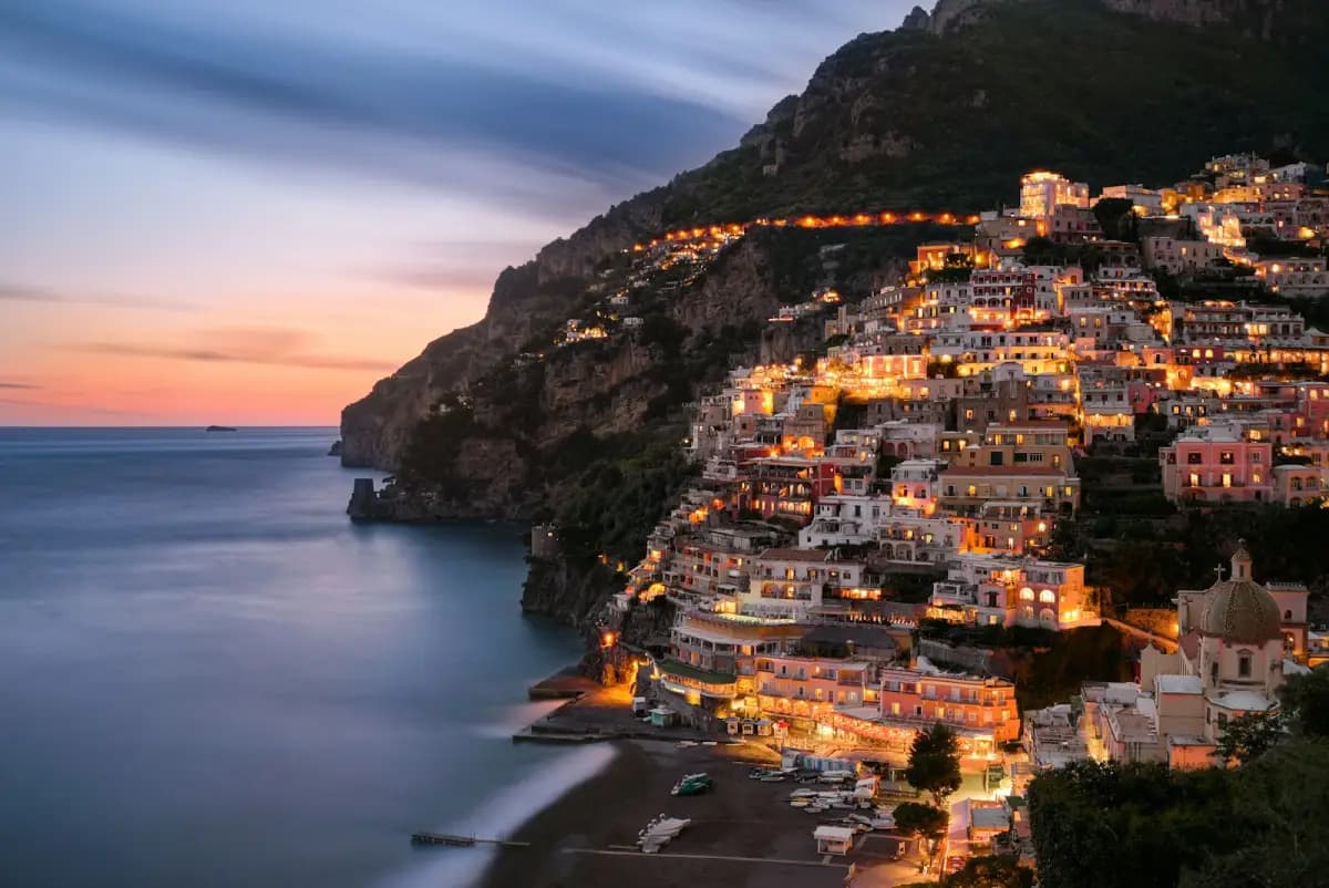Positano village lights along the Amalfi Coast at blue hour in Italy