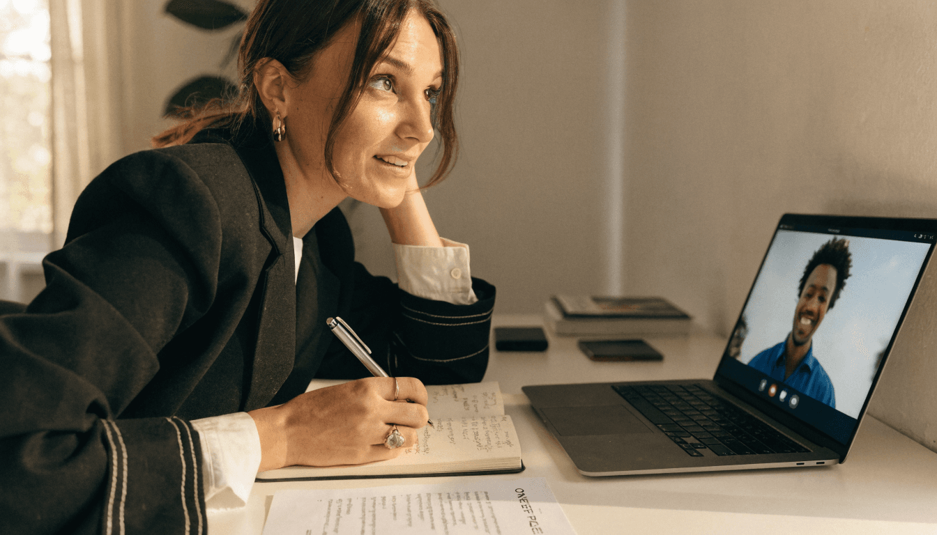 A travel creator on a professional planning call with notes and briefing context nearby
